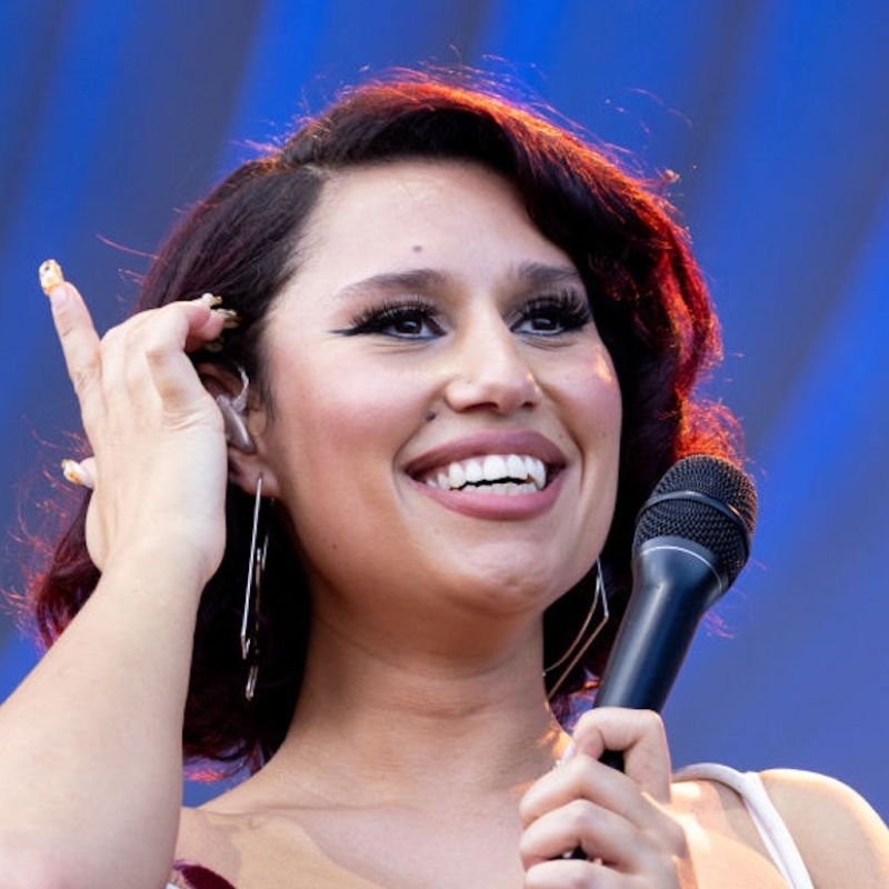 RAYE, British singer and songwriter known for her powerful voice and award-winning music performances.