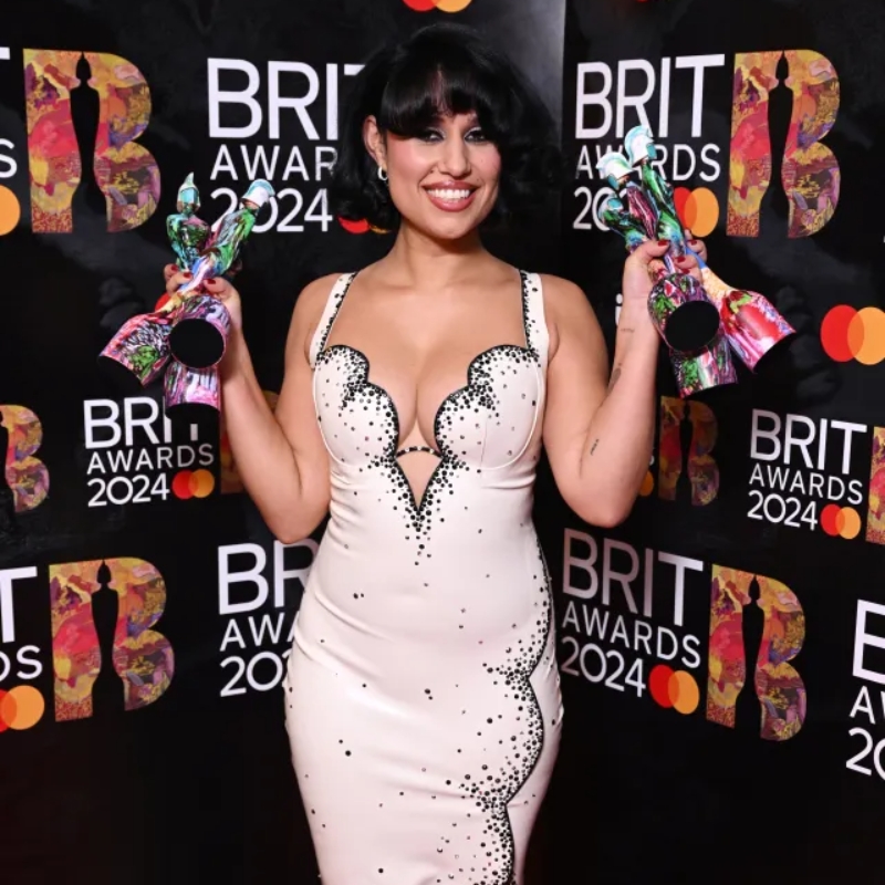 RAYE, British singer and songwriter known for her powerful voice and award-winning music performances.